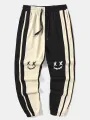 ChArmkpR Mens Smile Face Print Contrast Patchwork Loose Cuffed Sweatpants